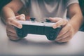 Young boy plays video game using a gamepad Royalty Free Stock Photo