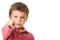 Young boy pointing with finger towards you, focus on finger Royalty Free Stock Photo