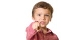 Young boy pointing with finger towards you, focus on finger Royalty Free Stock Photo