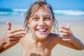 Young boy posing at the summer beach. Cute spectacled smiling happy 12 years old boy at seaside, looking at camera. Royalty Free Stock Photo