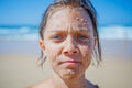 Young boy posing at the summer beach. Cute spectacled smiling happy 12 years old boy at seaside, looking at camera. Royalty Free Stock Photo