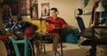 Young boy practices musician skills using drum kit