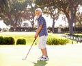Young Boy Practising Golf Royalty Free Stock Photo