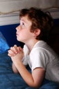 Young boy praying Royalty Free Stock Photo