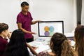 Young boy presenting a project to the team Royalty Free Stock Photo