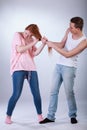 Young boy pulling girl's hair