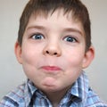 Young boy pulls a face Royalty Free Stock Photo