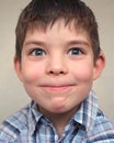 Young boy pulls a face Royalty Free Stock Photo