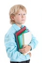 Young boy pupil embracing books with hands, looking at camera, isolated on white background Royalty Free Stock Photo