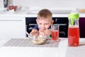 Young Boy Pushing Away Bowl of Breakfast Cereal