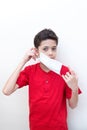Young boy putting face mask on. Royalty Free Stock Photo