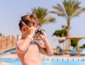 Young boy putting on his swimming goggles Royalty Free Stock Photo