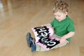 Young boy reading book