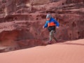 Young boy on the red sand dunes of the Wadi Rum desert, Jordan Royalty Free Stock Photo