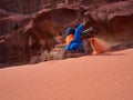 Young boy on the red sand dunes of the Wadi Rum desert, Jordan Royalty Free Stock Photo