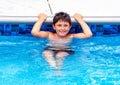 Young boy relaxing pool side Royalty Free Stock Photo