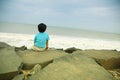 Young boy relaxing and watching the sea Royalty Free Stock Photo