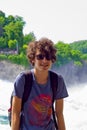 young boy in rhine falls, Switzerland Royalty Free Stock Photo