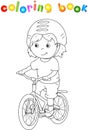 Young boy riding a bicycle in helmet