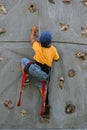 Young boy rock climbing Royalty Free Stock Photo