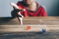 Young boy rolling / throwing a dice