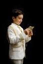 Young boy with rosary and prayer book