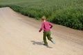 Young boy run in the fields