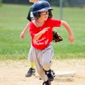 Young Boy running from second base to third base Royalty Free Stock Photo