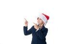 Young boy with Santa hat pointing at something Royalty Free Stock Photo