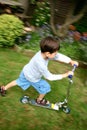 Young boy on scooter Royalty Free Stock Photo