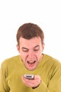 Young boy screaming on the mobile phone. Royalty Free Stock Photo