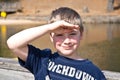 Young Boy Shading His Eyes Royalty Free Stock Photo