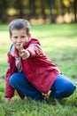 Young boy shooting with pointing finger at camera Royalty Free Stock Photo