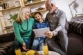 Boy showing his older grandparents new technology Royalty Free Stock Photo