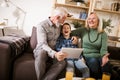 Boy showing his older grandparents new technology Royalty Free Stock Photo