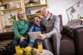 Boy showing his older grandparents new technology Royalty Free Stock Photo