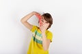 Young boy showing a red slime looks like gunk between his hands Royalty Free Stock Photo