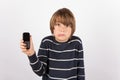 Young boy showing a simple phone is very upset