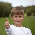 Young boy showing thumbs up Royalty Free Stock Photo