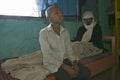 A young boy sits at the bedside of his mother who is infected with HIV/AIDS at Pepo La Tumaini Jangwani, HIV/AIDS Community