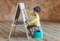 Young boy drawing on drawing board Royalty Free Stock Photo