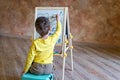 Young boy drawing on drawing board Royalty Free Stock Photo