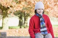 Young boy sitting on fence Royalty Free Stock Photo