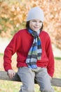 Young boy sitting on fence Royalty Free Stock Photo