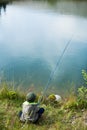 Young boy sitting and fishing Royalty Free Stock Photo