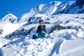 Young Boy Sitting On The Snow Mountain Royalty Free Stock Photo