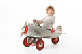 Young Boy Sitting In Toy Aeroplane Royalty Free Stock Photo