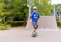 Young boy skateboarding at the park Royalty Free Stock Photo