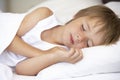 Young Boy Sleeping In Bed Royalty Free Stock Photo