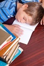 Young boy sleeping on his desk Royalty Free Stock Photo